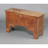 An 18th Century elm coffer formed from 6 planks with hinged lid and iron lock, raised on bracket