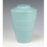 A Keith Murray Wedgwood pale blue tapered ribbed vase, printed marks, 19cm