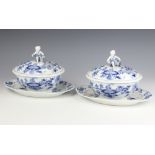 A pair of Meissen blue and white oval tureens and covers, the lids with cherub finials holding