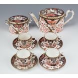 A Royal Crown Derby Imari pattern part tea set comprising teapot (stuck finial), a sucrier with lid,