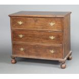An 18th/19th Century oak chest of 3 long drawers with replacement brass swan neck drop handles and