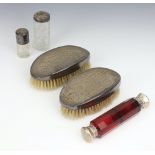 A Victorian ruby glass double scent, 2 silver mounted toilet jars and 2 silver mounted hair brushes