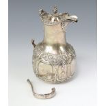 A Victorian repousse silver hot water jug Sheffield 1858, 328 grams gross The handle is broken and