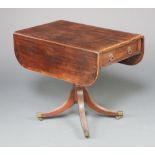 A 19th Century crossbanded mahogany pedestal Pembroke table fitted a frieze drawer, raised on turned