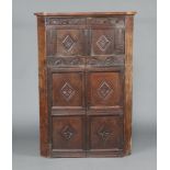 An oak corner cabinet, the front formed from old timbers removed from coffers marked 1651 150cm h
