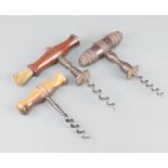 A 19th Century steel and turned mahogany corkscrew complete with brush 6cm and 2 other corkscrews