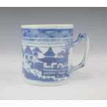 A Chinese 19th century export blue and white mug with extensive riverscape and entwined handle 9.