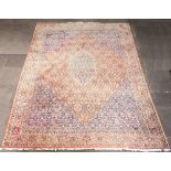 A pink, blue and white ground Persian carpet with central diamond shaped medallion 393cm x 296cm