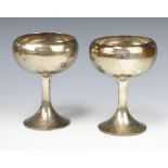 A pair of stylish silver cups with wide flared bases 658 grams, Sheffield 1911, retailed and made by