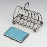 A Victorian silver 7 bar toast heart pattern toast rack London 1896 and a guilloche enamel cigarette