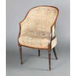 An Edwardian inlaid mahogany tub back chair, raised on turned and fluted supports upholstered in