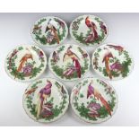 Seven Chelsea plates circa 1758-70 decorated exotic birds amongst foliage the central bird perched