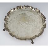 A silver salver with Chippendale rim on pad feet Birmingham 1936, 504 grams