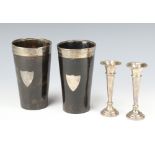 A pair of Athletic trophy cups in the form of horn beakers, the silver mounts to the top both