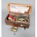 S Mawsons and Thoms. The Improved Magneto-Electric shock machine, boxed Box has water damage,