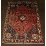 A red, blue and white ground Afghan carpet with central medallion 292cm x 210cm, some wear and