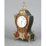 A 19th Century French 8 day timepiece with 8cm enamelled dial, Roman numerals, contained in a red