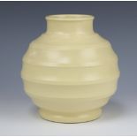 A Wedgwood Keith Murray cream bulbous vase with ribbed decoration, printed mark 15.5cm