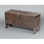 A late 16th early 17th Century oak coffer constructed of 6 planks with long iron hinges and iron
