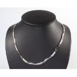 A contemporary white metal 375 necklace, 44cm