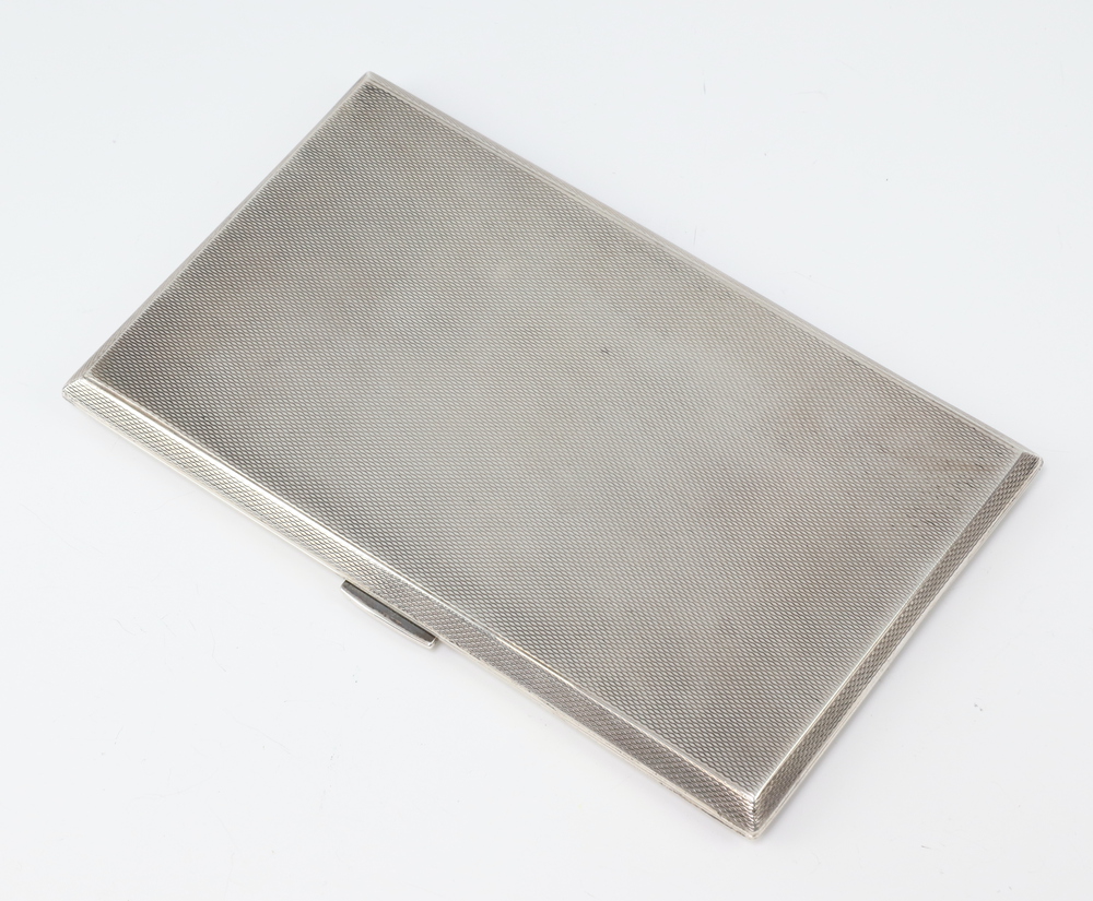 A silver engine turned cigarette case Birmingham 1947, 218 grams gross