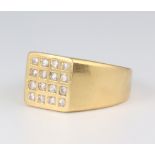 A gentleman's 18ct yellow gold diamond set signet ring comprising 16 brilliant cut diamonds, approx.