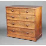 A Victorian bleached mahogany chest of 2 short and 2 long drawers with turned handles and brass