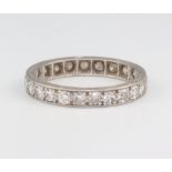 A white metal stamped Plat diamond eternity ring comprising 24 brilliant cut diamonds each