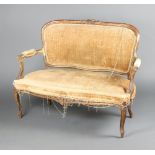 A French 19th/20th Century gilt painted 2 seat salon sofa, the crest carved flowers, raised on