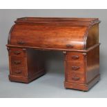 A Victorian mahogany cylinder desk with 3/4 gallery, the interior fitted pigeon holes and drawers,
