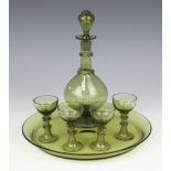 A German pale green glass liqueur set comprising decanter and stopper, 4 tots and a tray One tot