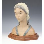 A Lladro matt bust "Little Girl" 2024 34cm on a wooden plinth