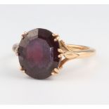 A yellow metal 18ct oval cut garnet ring 6.5 grams, size S