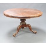 A Victorian mahogany circular snap top loo table raised on a turned column and tripod base 70cm h