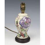 A modern Moorcroft baluster table lamp decorated with flowers 19cm