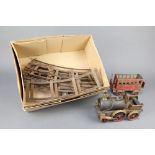 A 19th Century brass scratch built steam locomotive 17cm h x 22cm l with associated carriage and