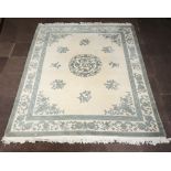 A grey and white ground Indian carpet with central medallion 303cm x 244cm Moth damage to the