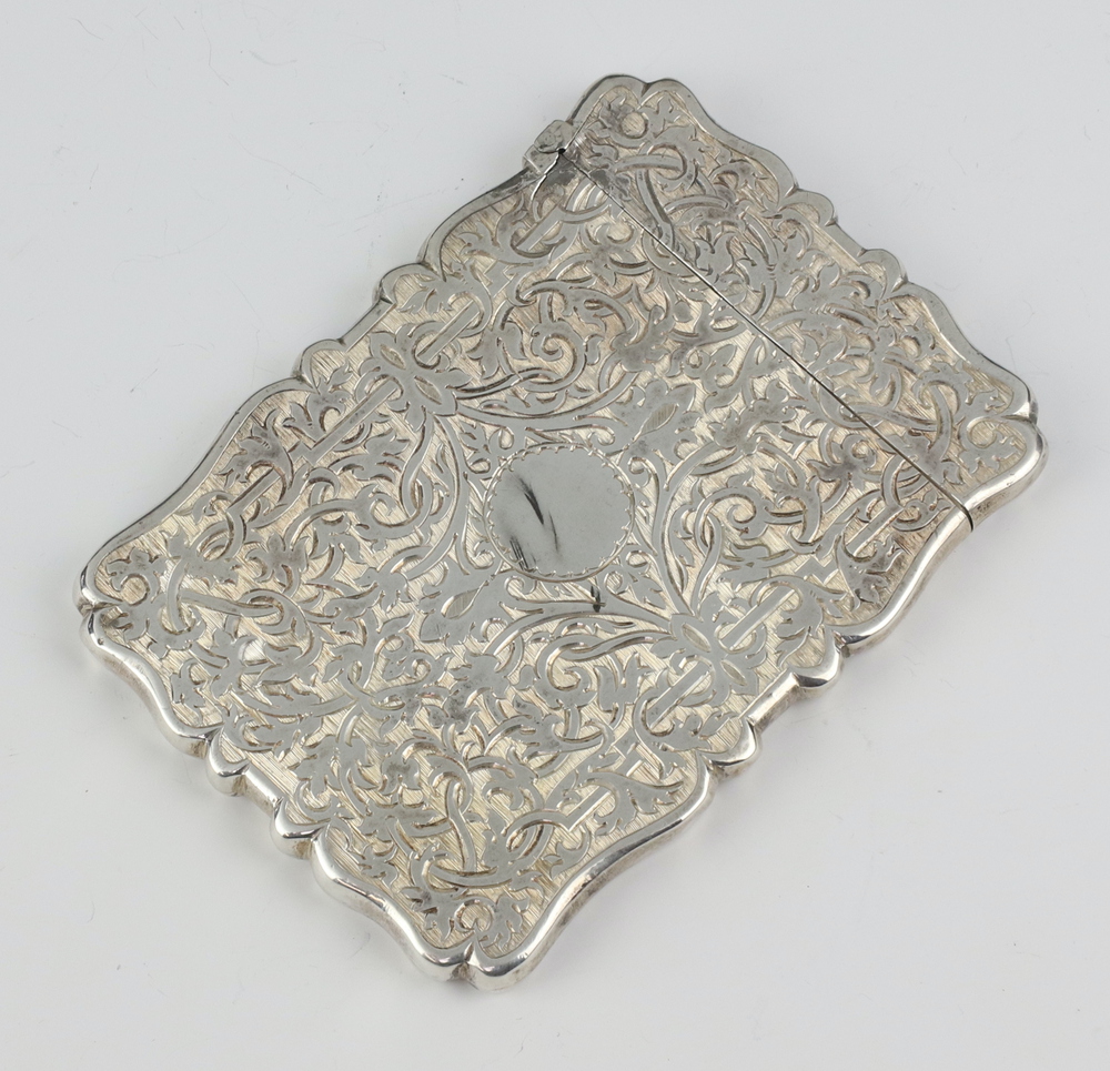 A Victorian silver card case with engraved floral decoration and vacant cartouche Birmingham 1848 61