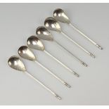 A set of 6 stylish Arts and Crafts silver coffee spoons with hammer pattern bowls, Chester 1928,