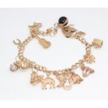 A 9ct yellow gold charm bracelet, gross weight 21.8 grams