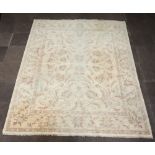 A Pakistani white and floral patterned Caucasian style carpet 313cm x 249cm