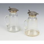 A pair of silver mounted glass spirit bottles Birmingham 1912 9.5cm