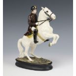 A Beswick figure Lipizzaner with rider no.2467, second version, white gloss, modelled by Graham