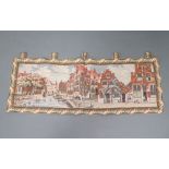 A Continental machine made tapestry of a canal scene with buildings 150cm x 58cm