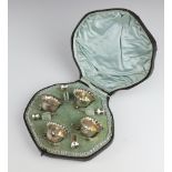 An Edwardian silver 8 piece condiment on ball feet including spoons Chester 1901, 63 grams,