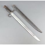 A Japanese Type 30 bayonet with wooden grip, the blade with star mark and complete with scabbard The