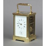 A 20th Century carriage, striking on gong alarm clock, with 6cm enamelled dial, Roman numerals,