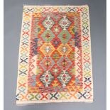 A white, turquoise, green and tan ground Chobi Kilim rug 145cm x 98cm