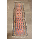 A pink, blue and white ground Kilim runner with all over hook design to the centre within a 3 row