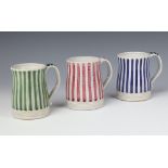 Three Rye pottery mugs decorated with blue, pink and green stripes